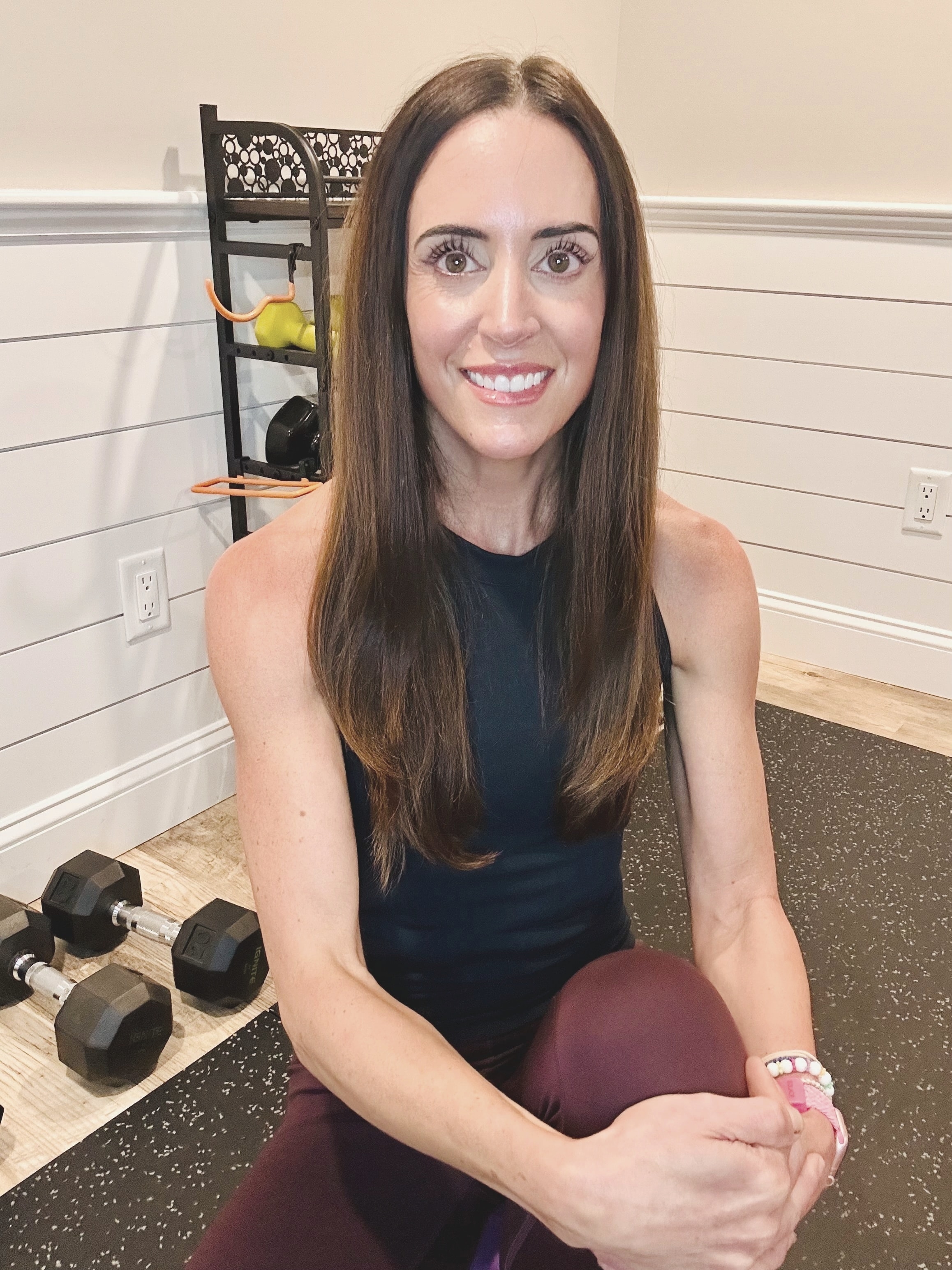Erica Marken, personal fitness coach, standing confidently in a gym